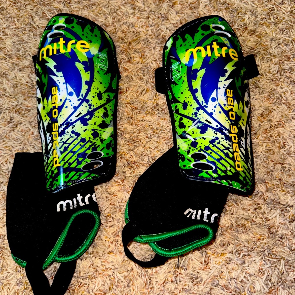Mitre soccer shin guards.